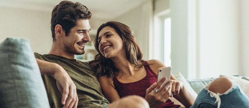 Loving couple relaxing on couch