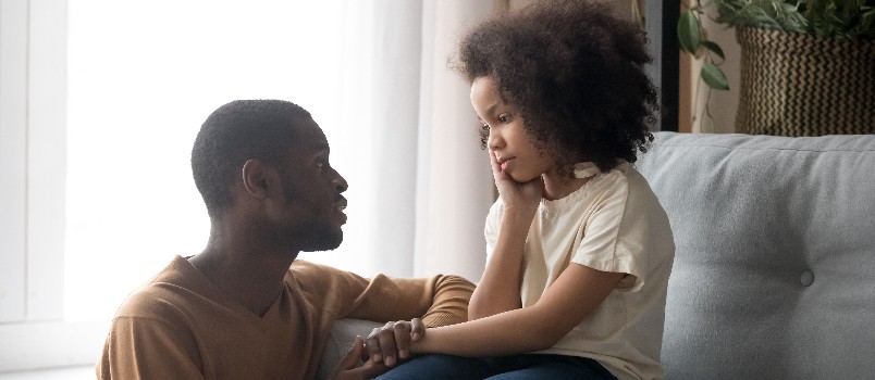 Father talking to upset daughter
