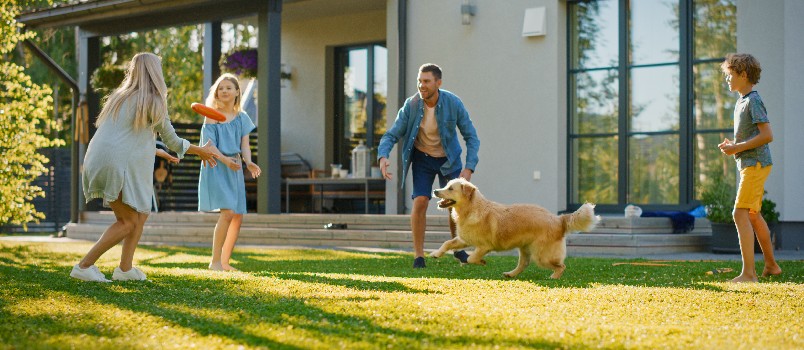 Beautiful family playing outside in garden