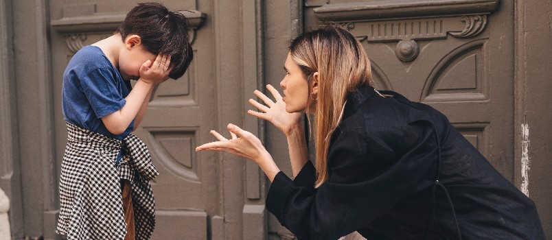 Mother scolding her son