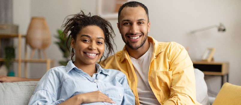Happy couple relaxing on couch
