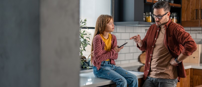 Angry father scolding her daughter