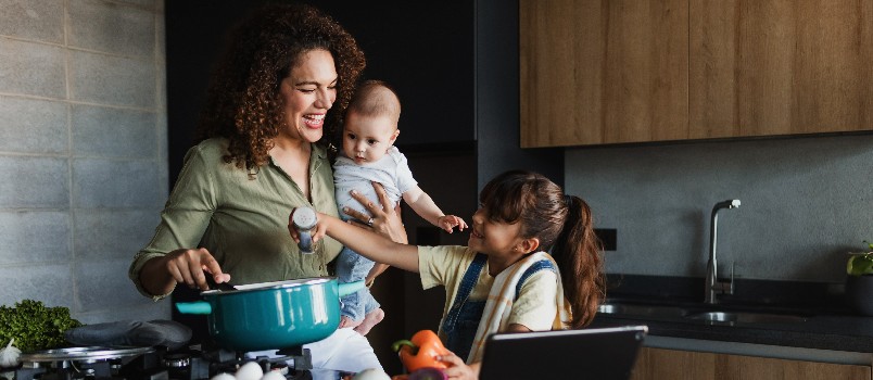 Mother and daughter cooking together