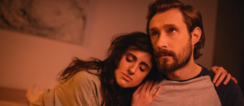 Woman hugging sad man