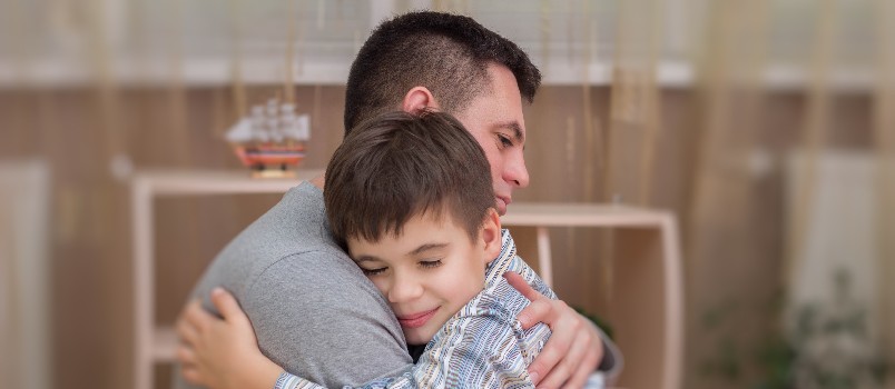 Father and son hugging each other
