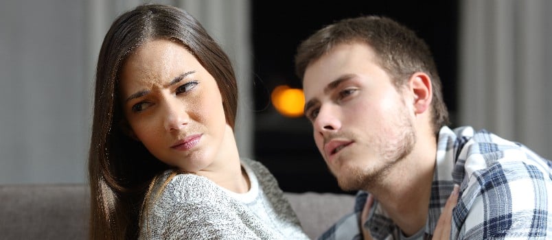 Man trying to get intimate while woman is rejecting