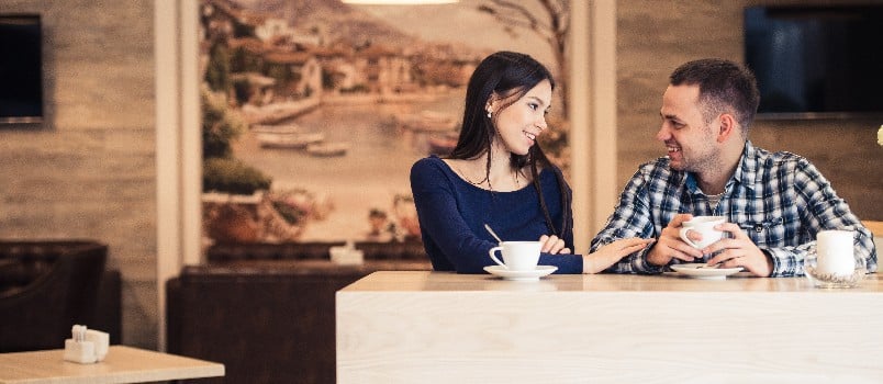 Young couple talking at coffee shop