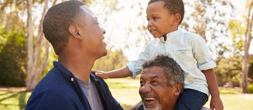 Grandfather son having fun in park