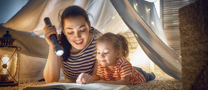 family bedtime mom child daughter reading