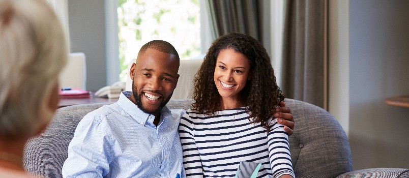Young couple taking financial advice