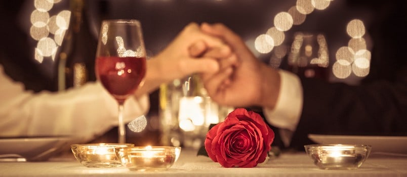 Couple holding each others hand on a date