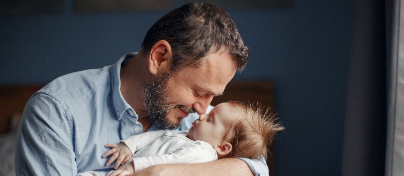 Man holding baby