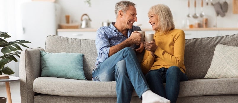 Happy couple drinking coffee together