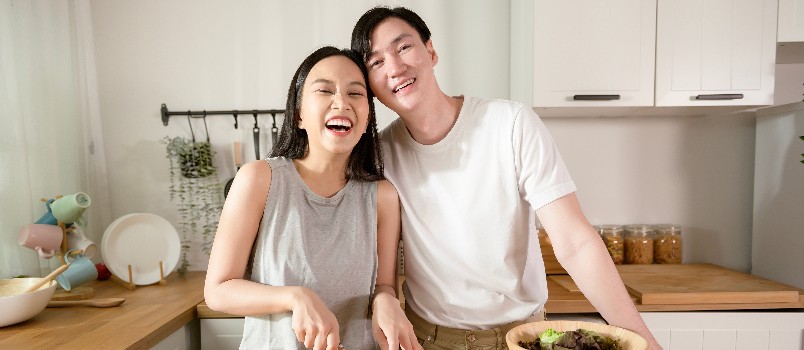 Couple enjoying in kitchen