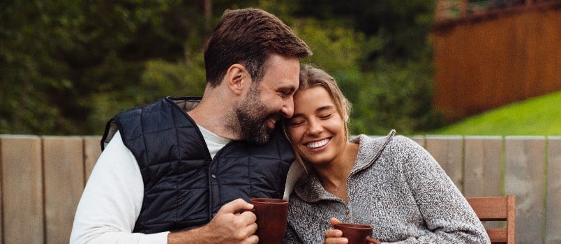 Happy couple enjoying tea 