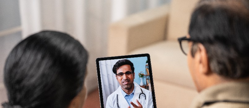 Senior couple taking online consultation