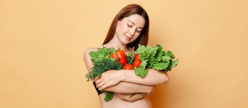Woman holding vegetable