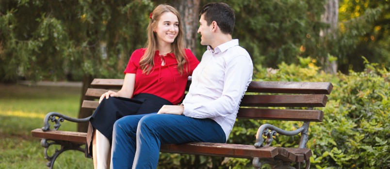 couple setting on sheet