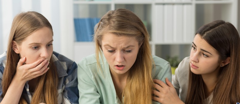 terrified teenage girl lying on bed