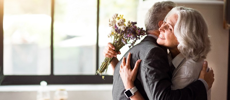 Happy elder couple celebrating anniversary