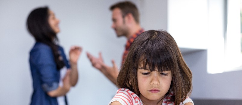 Girl hearing her parents fighting