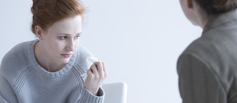 women thinking while having conversation