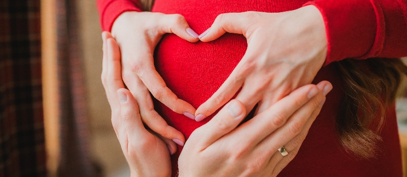 Couple making heart shape