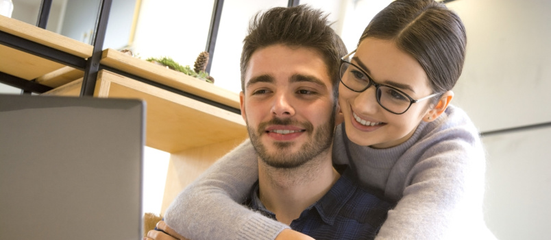 Young couple looking at laptop
