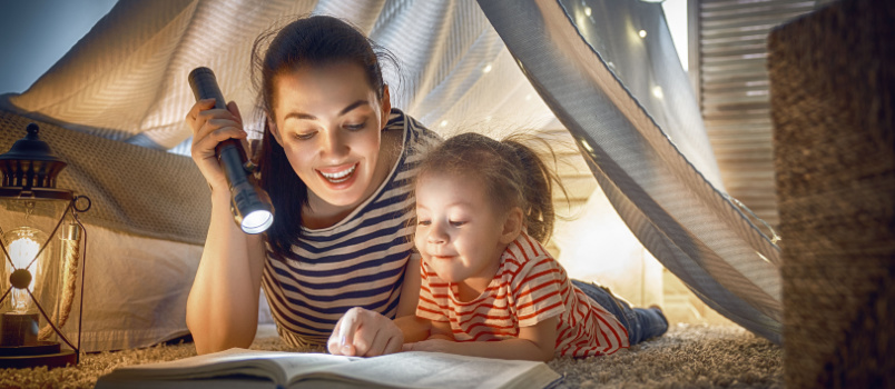 Mom and daughter reading book