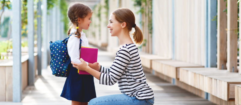 Mother sending her daughter in school on first day