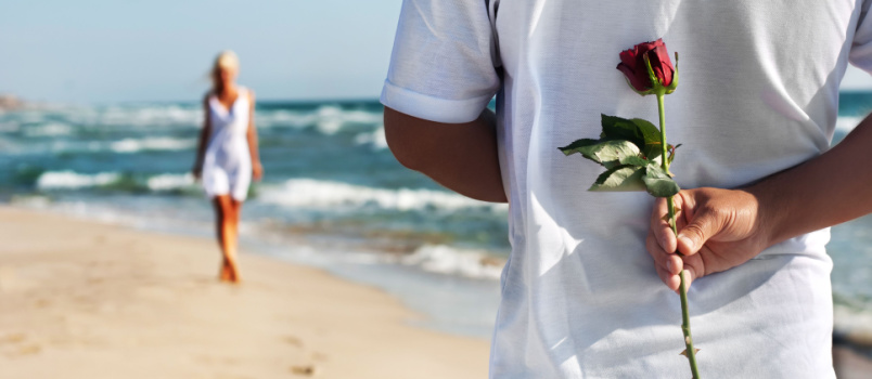 Man with rose waiting for his girl