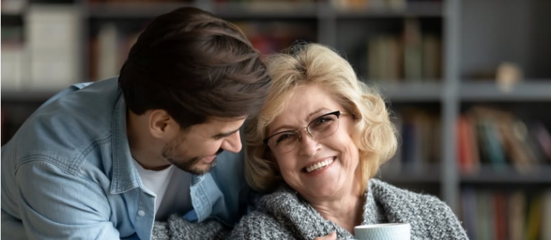 Happy middle aged woman having coffee
