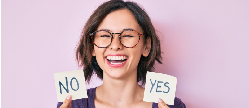 Young bold girl holding yes and no