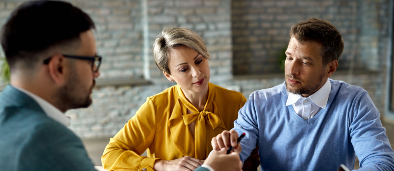 Couple having meeting with insurance person