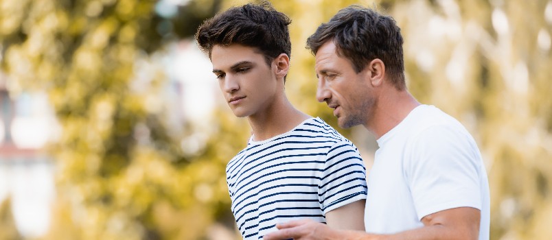 Father talking to teenager son