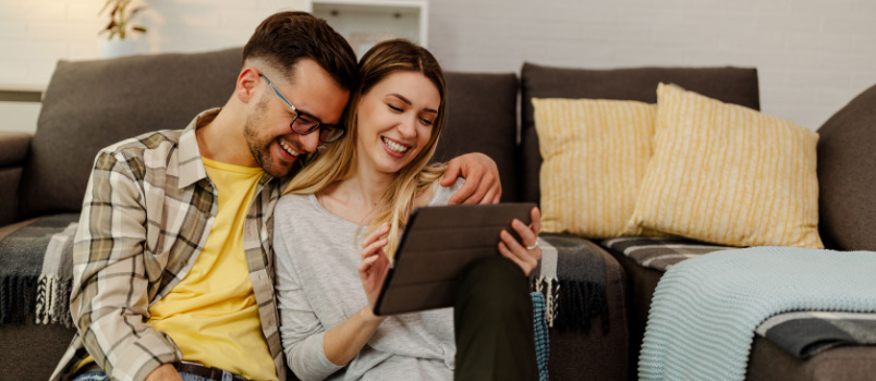 Young couple sitting on floor