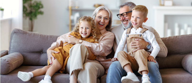 happy family joyful little children hugging grandparents
