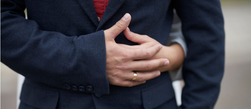 Bride hugs groom wedding close hands
