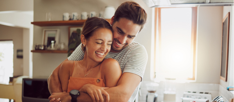 Love romantic couple hugging in kitchen