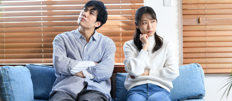 couple thinking fighting living room