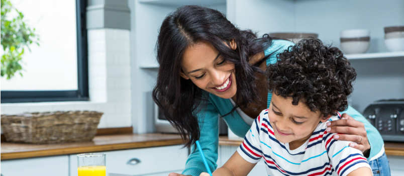 Mother helping son doing homework