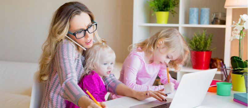 Busy working woman handling kids while working
