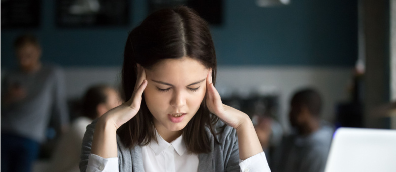 Stressed student having headache 