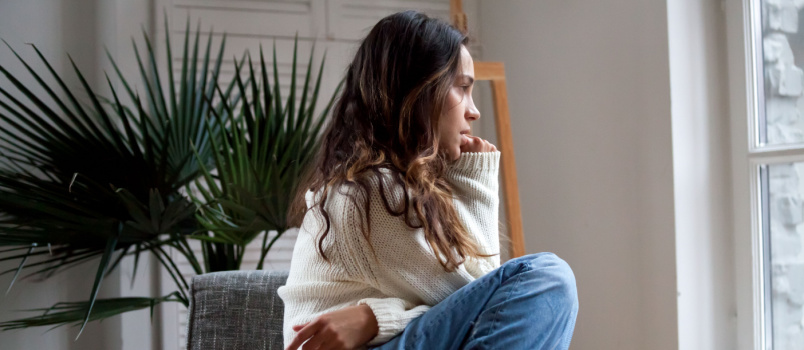 Sad girl sitting on chair