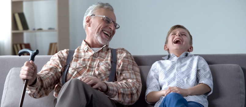 old man and boy laughing