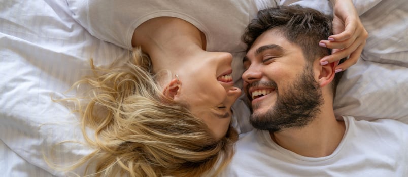 Couple in love laying on bed 