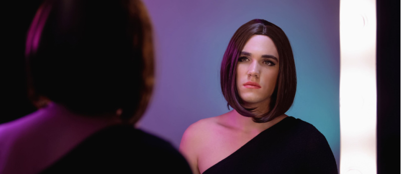 Sad woman looking into mirror
