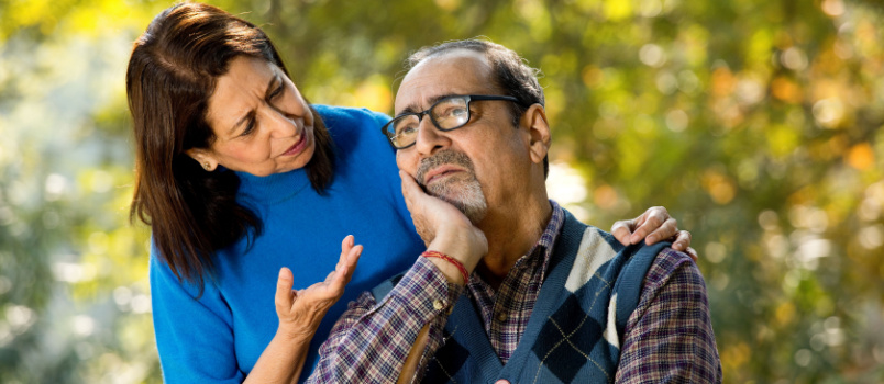 Senior woman comforting husband