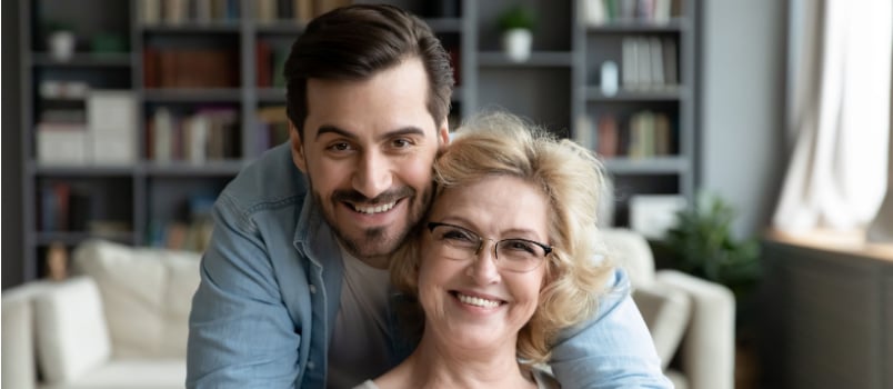 Adult man smiling hugging