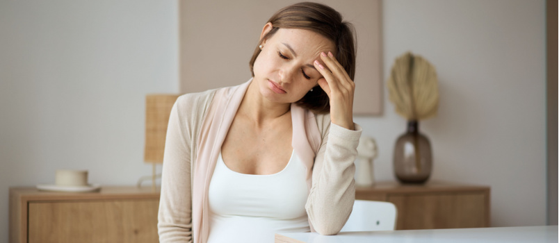 Mother suffering from headache